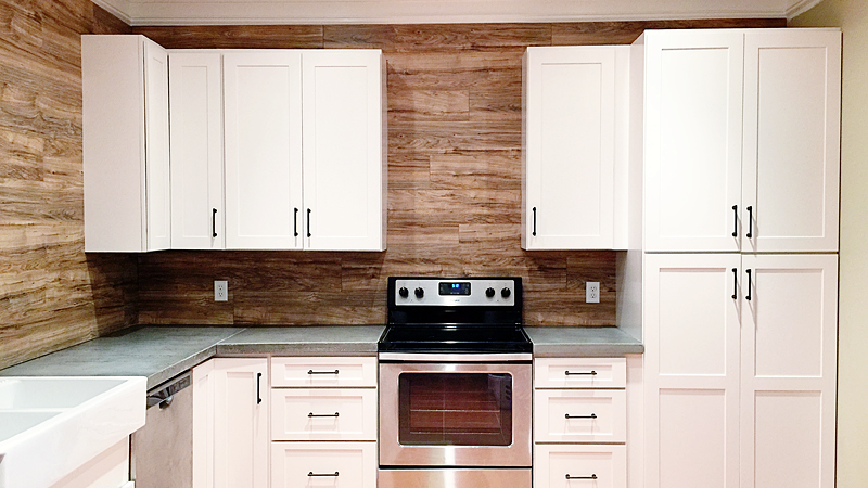 Use Laminate Flooring As A Durable, Easy To Clean Backsplash In Your Kitchen