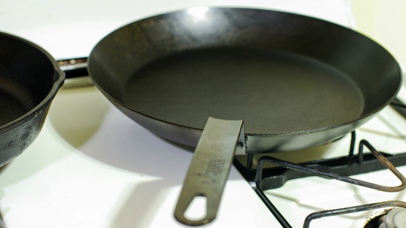 Season A Carbon Steel Pan With Oil And Potato Peels